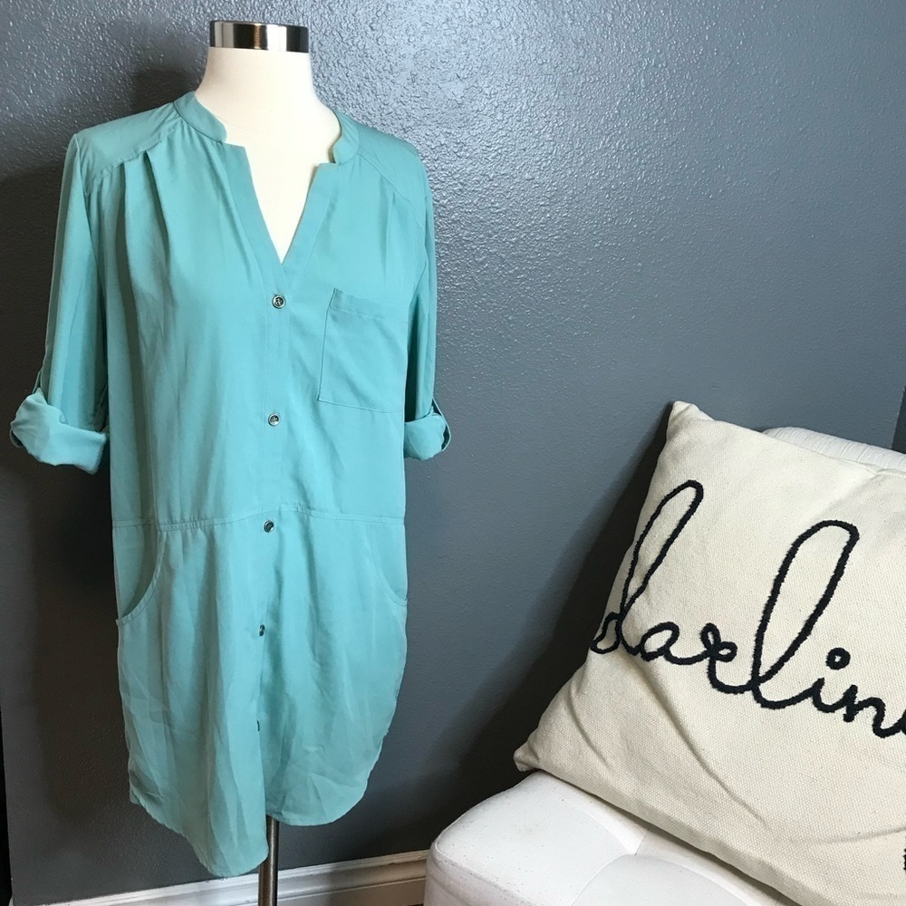Lush green button front blouse with pockets size small.